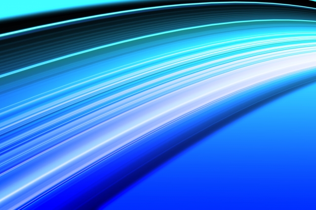 光が走る青い軌跡。IOWN構想が描く“分散・省エネ・低遅延”の未来を象徴するイメージ。